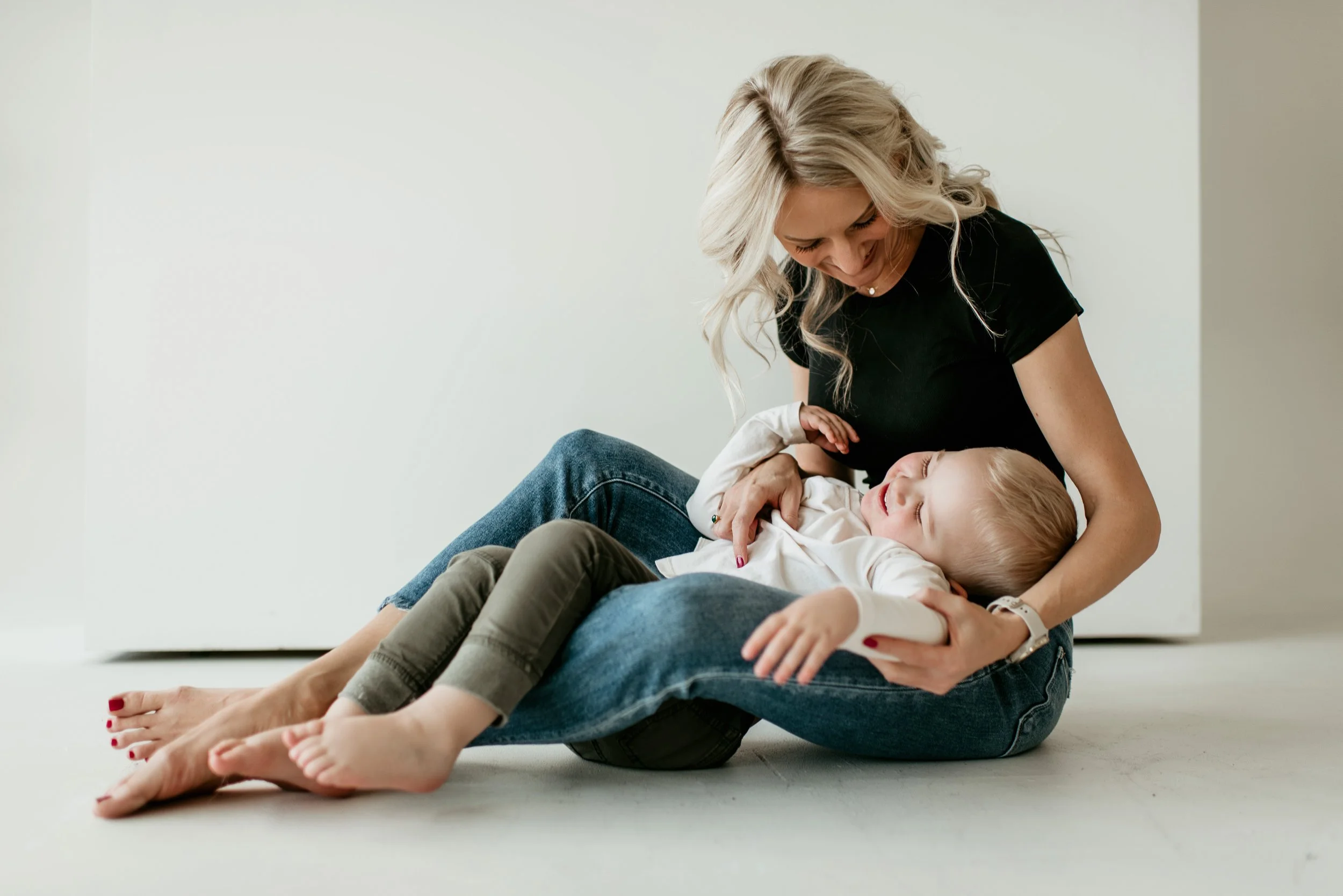 Katie　BABY-SITS! Baby sitting on feet stock photo. Image of baby, stripe - 3966292